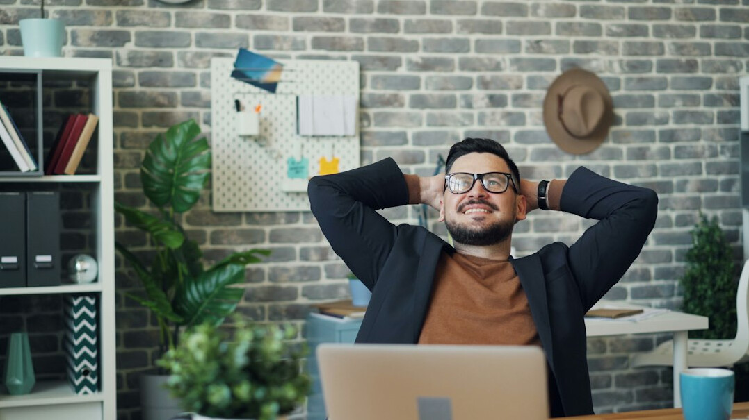person stretching in office