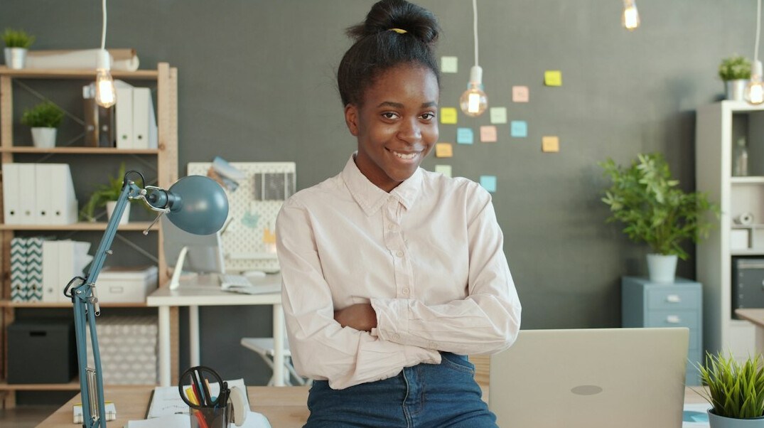 woman stretching in modern office