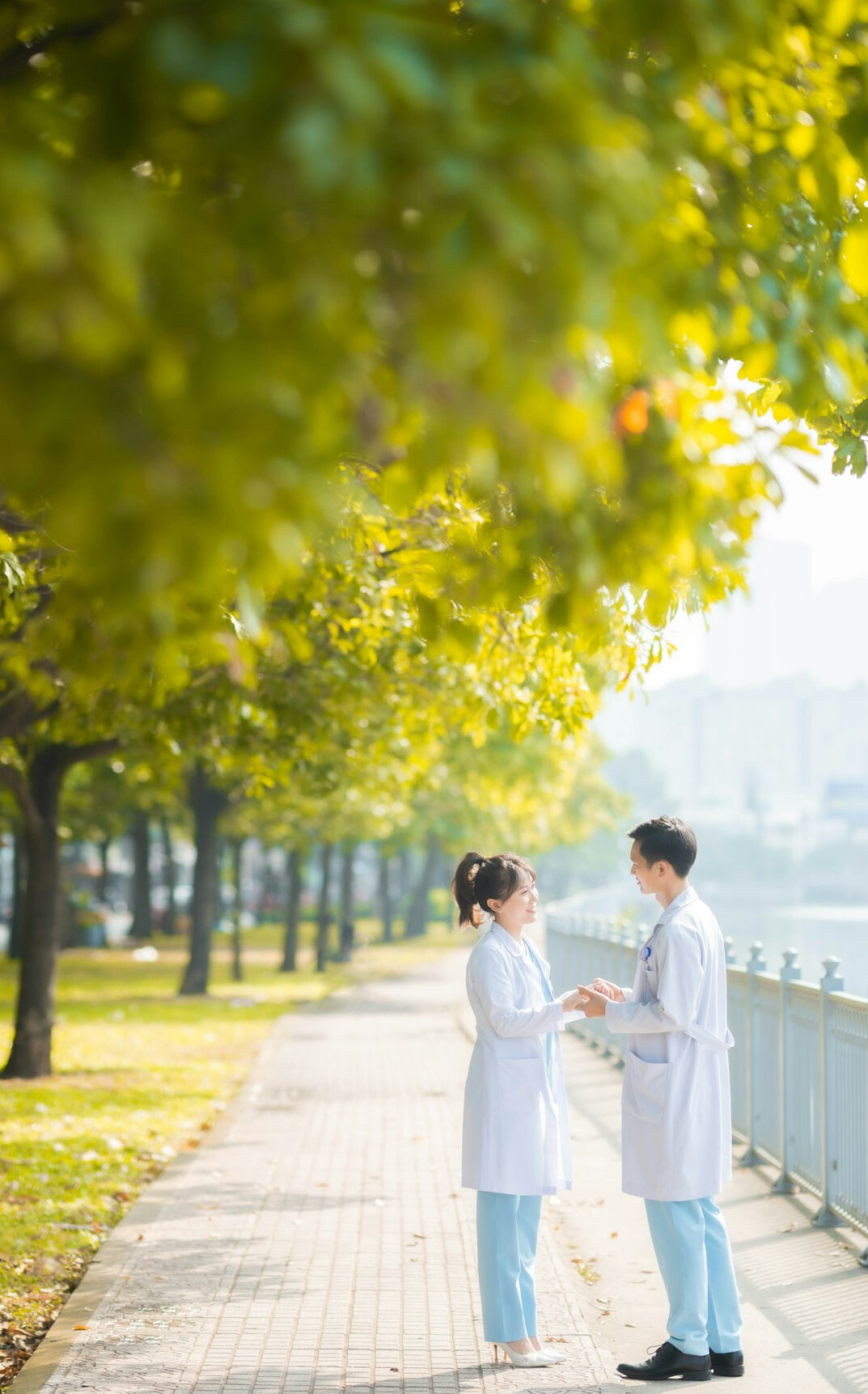 Doctor and HR representative shaking hands after partnership agreement